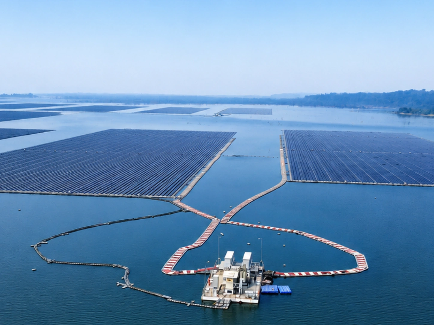 Floating solar panels on a reservoir representing cross-border clean energy collaboration in Asia